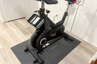 The SOLE SB1200 Exercise Bike on a black mat