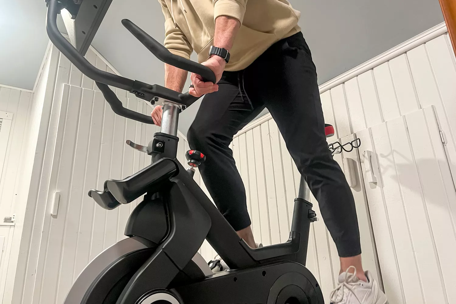 A person rides the SOLE SB1200 Exercise Bike