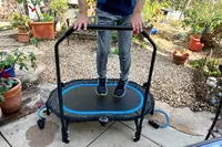A person jumps on the Stamina Oval Fitness Trampoline