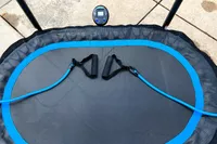 The resistance bands attached to the Stamina Oval Fitness Trampoline