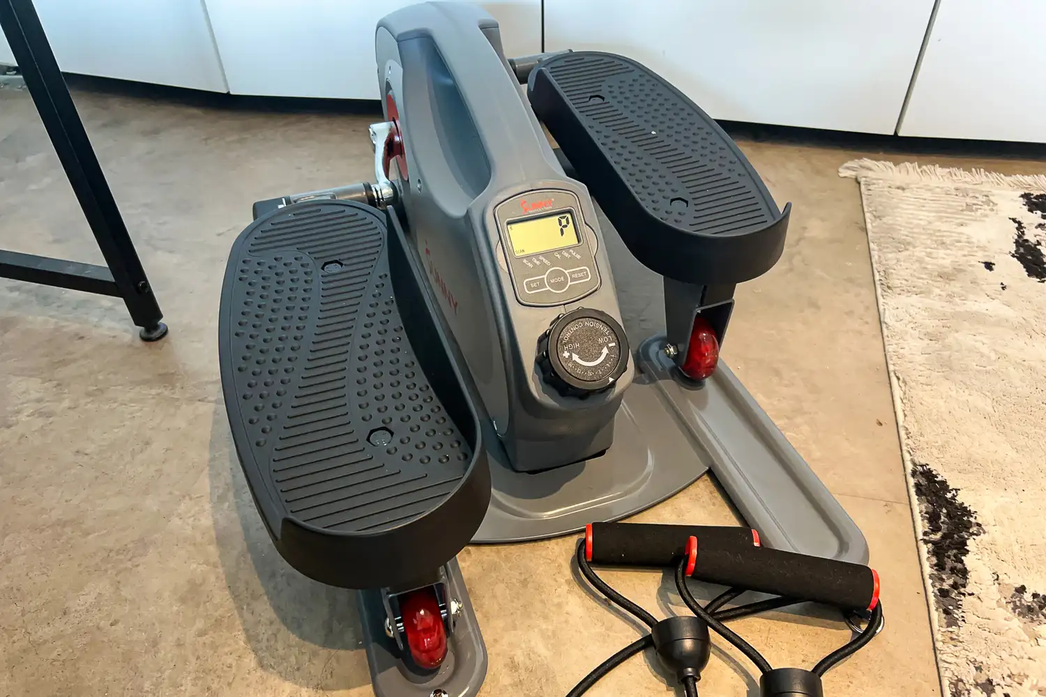 The dial and digital display on the Sunny Health & Fitness Smart Stand/Sit Mini Elliptical Exercise Trainer