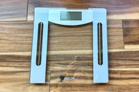 The Taylor Weight Tracking Smart Scale with Bluetooth Sync on a wooden floor