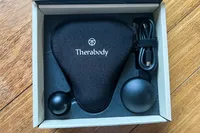 The Therabody Theragun Mini (3rd Generation) in a storage box