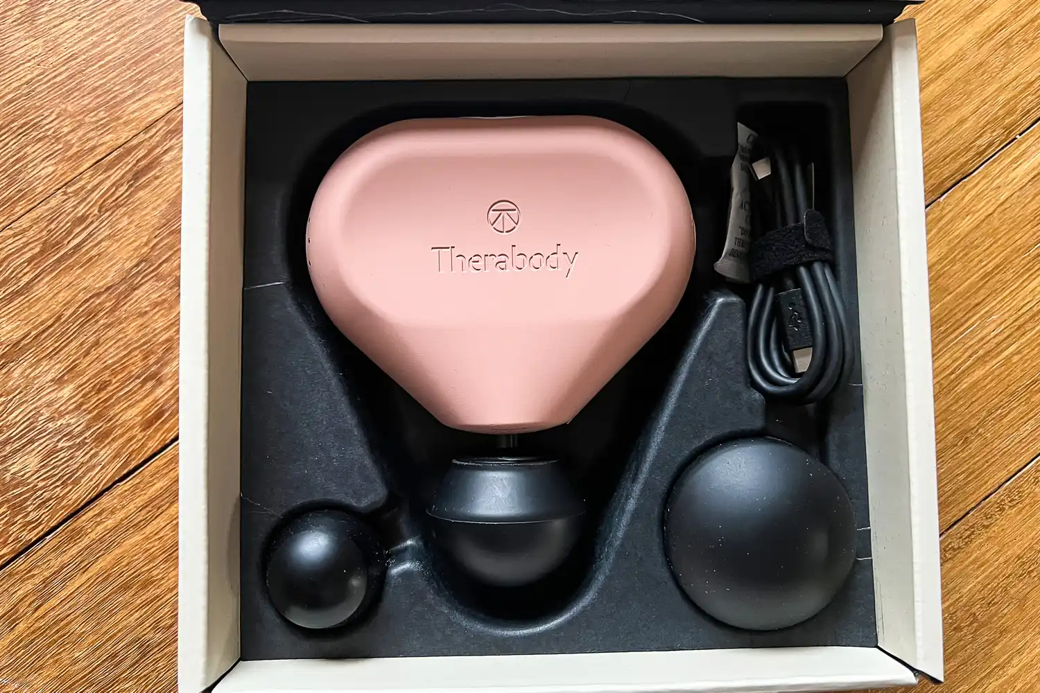 The Therabody Theragun Mini (3rd Generation) in a shipping box