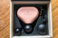 The Therabody Theragun Mini (3rd Generation) in a shipping box