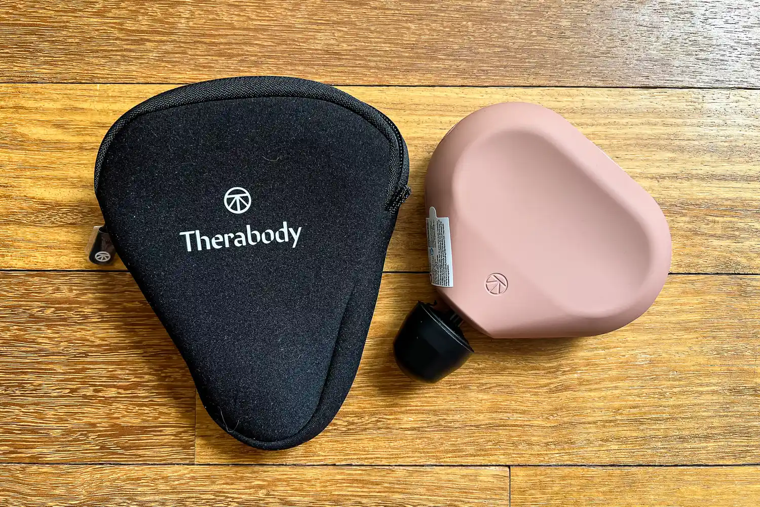 The Therabody Theragun Mini (3rd Generation) with storage bag