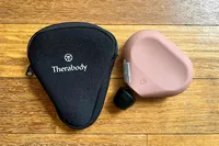 The Therabody Theragun Mini (3rd Generation) with storage bag