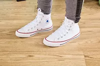 Person wearing Converse Chuck Taylor All Star Sneakers