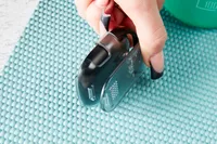 A person opening the clip on the 3DActive 3DFitBud Simple Step Counter