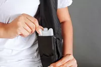 Person using pocket of Hyperwear Hyper Vest Fit Weighted Vest for Women