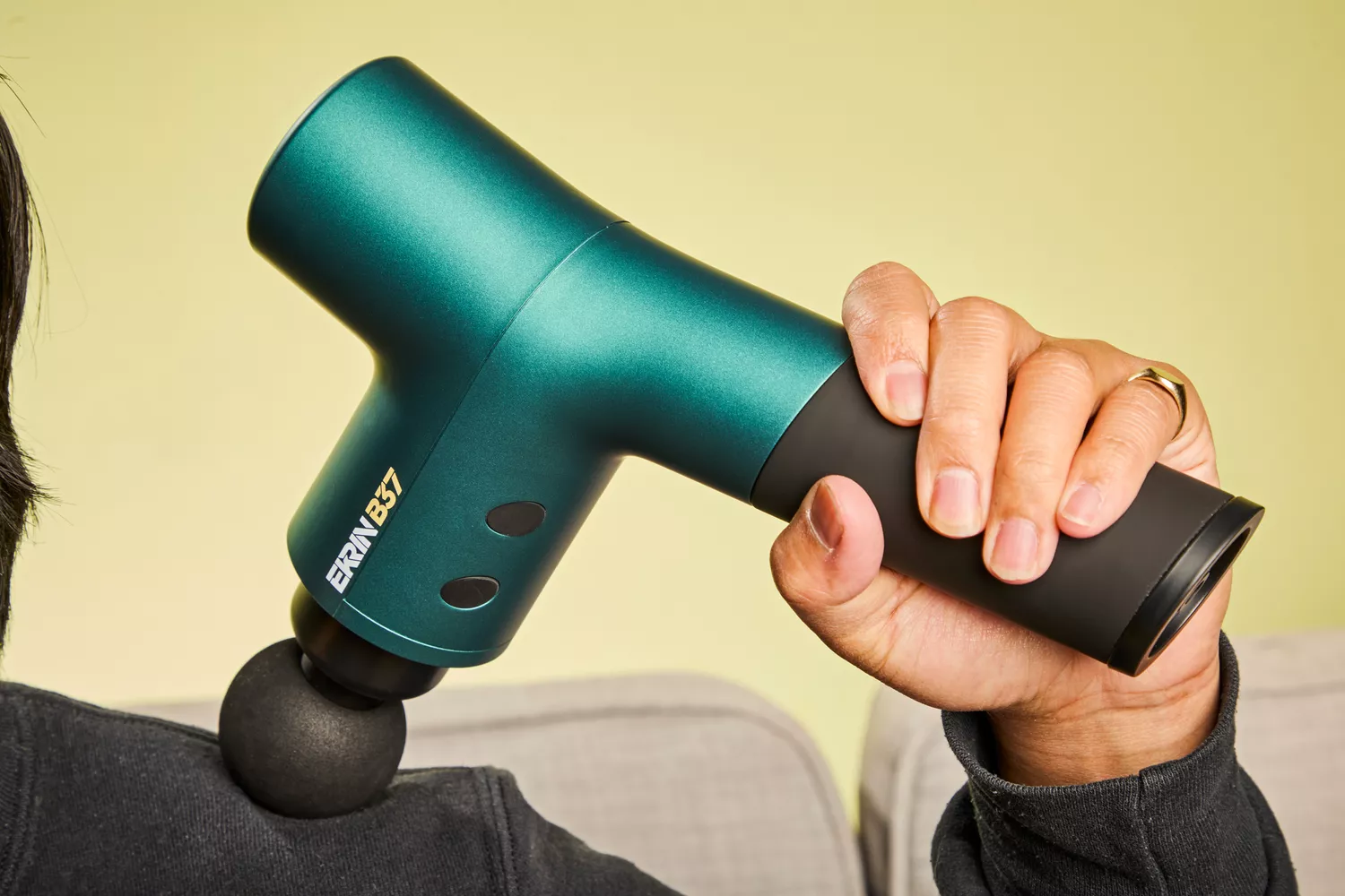 Person using Ekrin Athletics B37 Percussion Massager