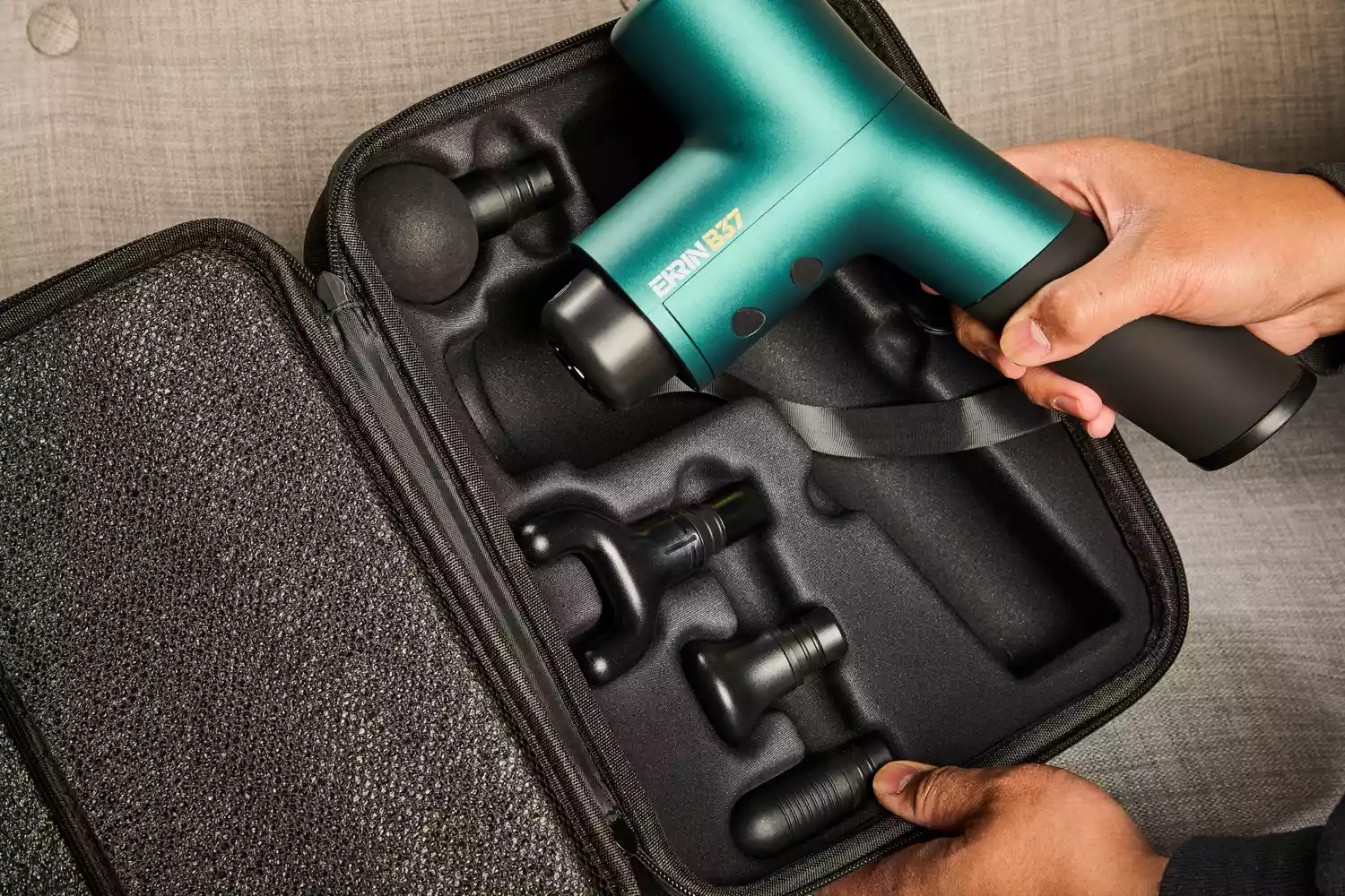 Person holding Ekrin Athletics B37 Percussion Massager