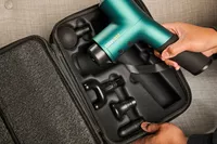 Person holding Ekrin Athletics B37 Percussion Massager