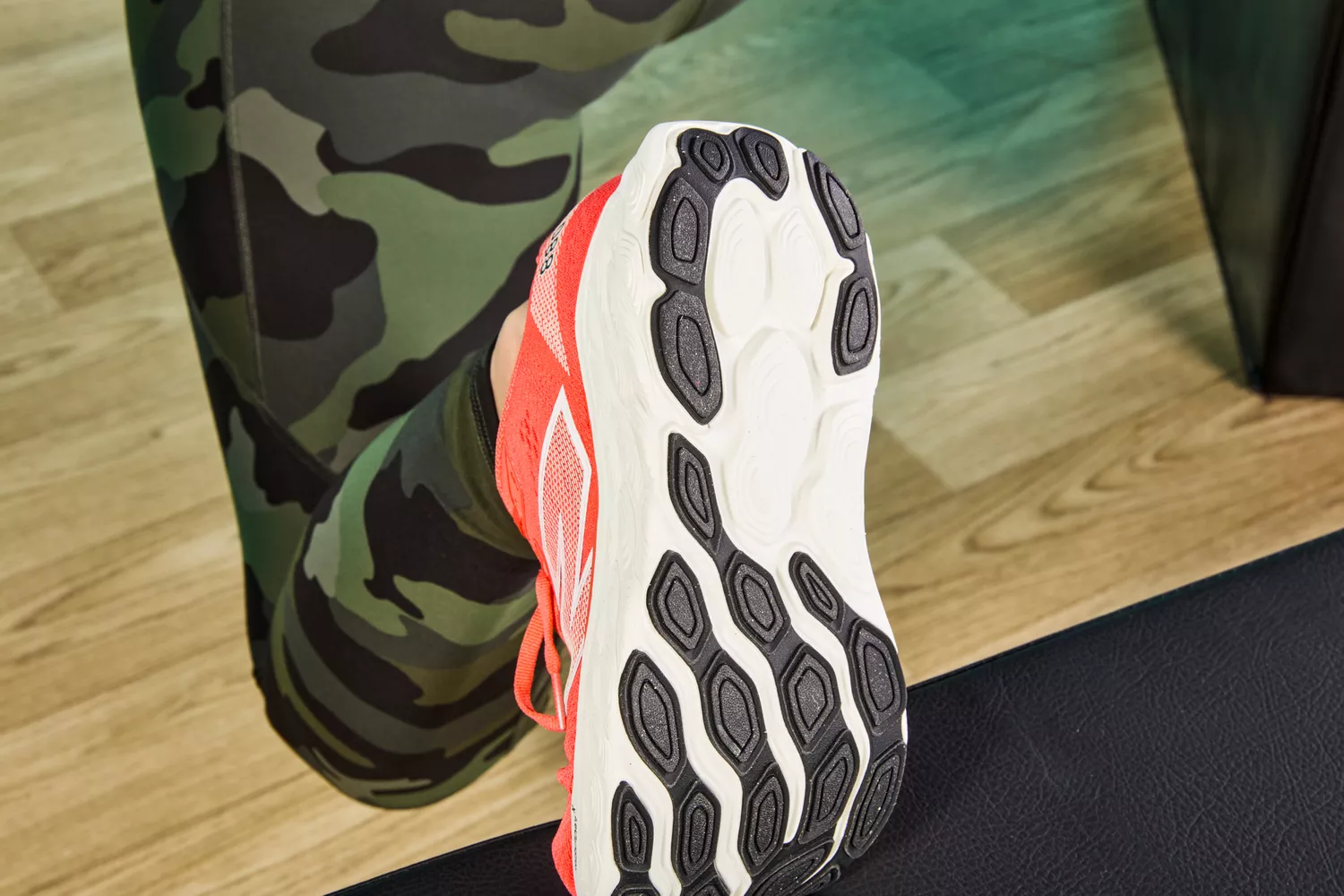 Person lifting foot showing bottom of New Balance Women's Fresh Foam X 880v14