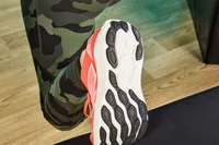 Person lifting foot showing bottom of New Balance Women's Fresh Foam X 880v14