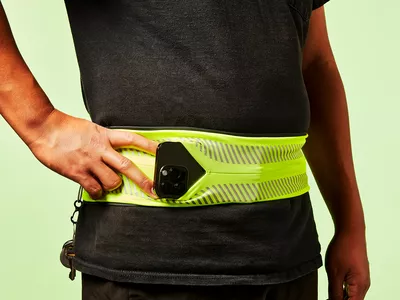 iPhone poking out of a waistband phone holder