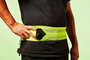 iPhone poking out of a waistband phone holder