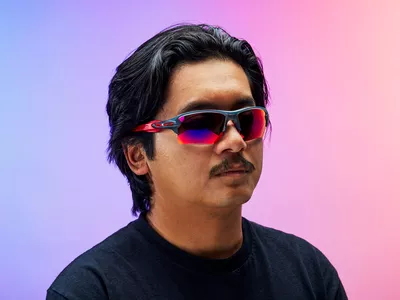 A person wearing sports sunglasses