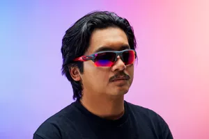 A person wearing sports sunglasses