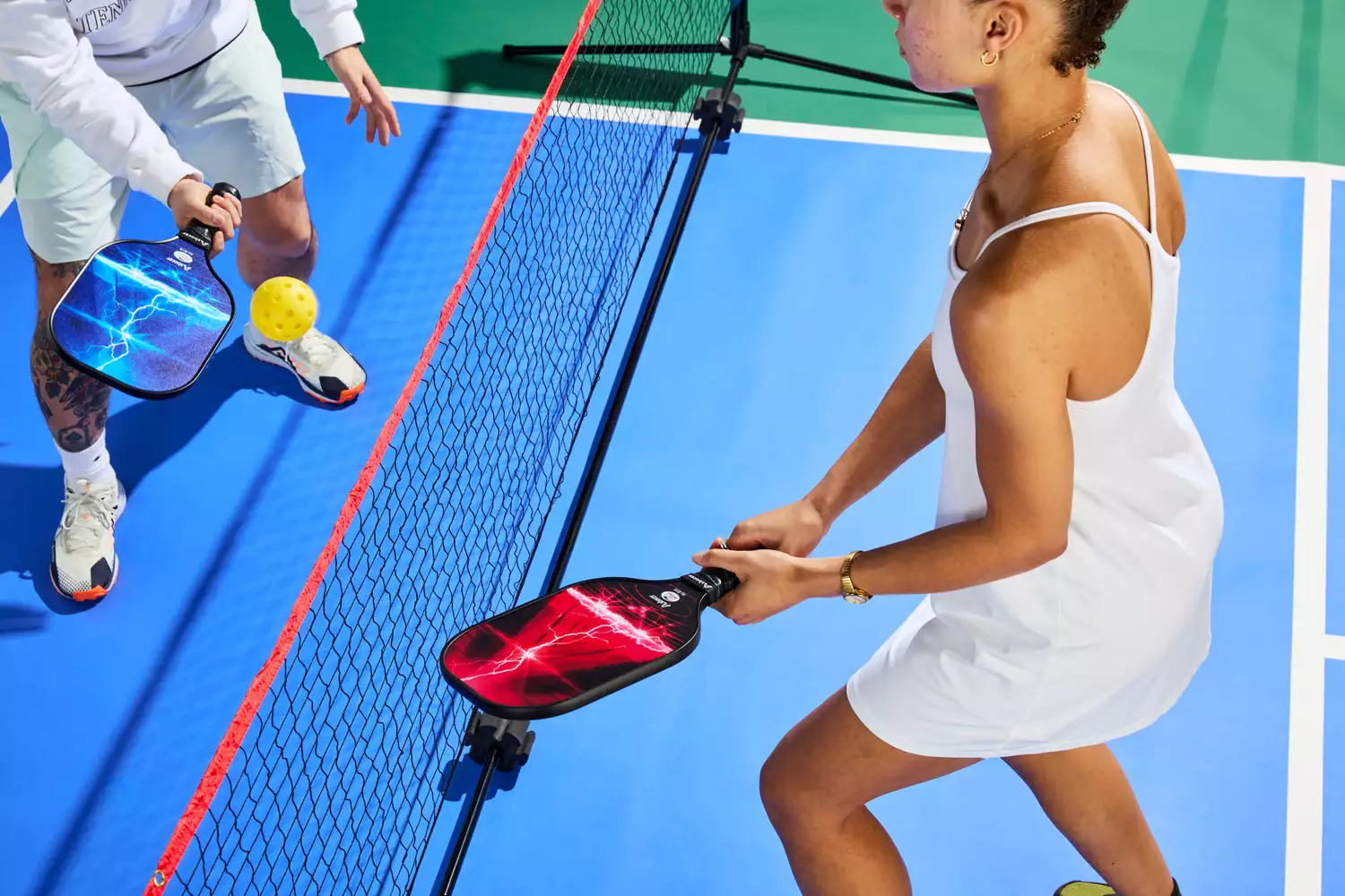 Person playing pickleball with Asbocer USAPA Approved Pickleball Paddles Set of 2