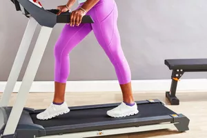 Person wearing lululemon Original Fast and Free High-Rise Crop while walking on treadmill