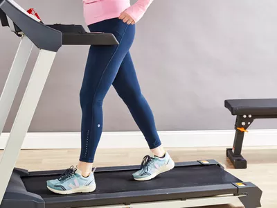 Person walking on treadmill wearing lululemon Swift Speed High-Rise Tight