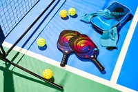 Panel Sound USAPA Approved Fiberglass Pickleball Paddles Set laying out on pickleball court