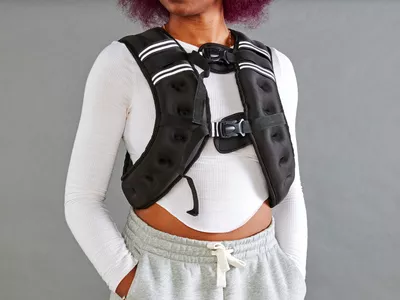 Person wearing Prodigen Weighted Vest with hands in pockets