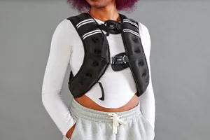 Person wearing Prodigen Weighted Vest with hands in pockets