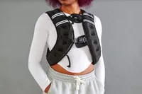 Person wearing Prodigen Weighted Vest with hands in pockets