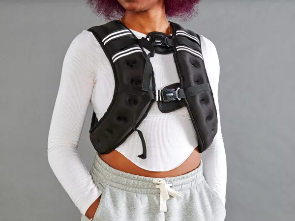 Person wearing Prodigen Weighted Vest with hands in pockets