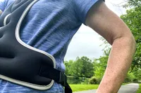 The buckle on the side of the Tone Fitness HHWV-TN Weighted Vest