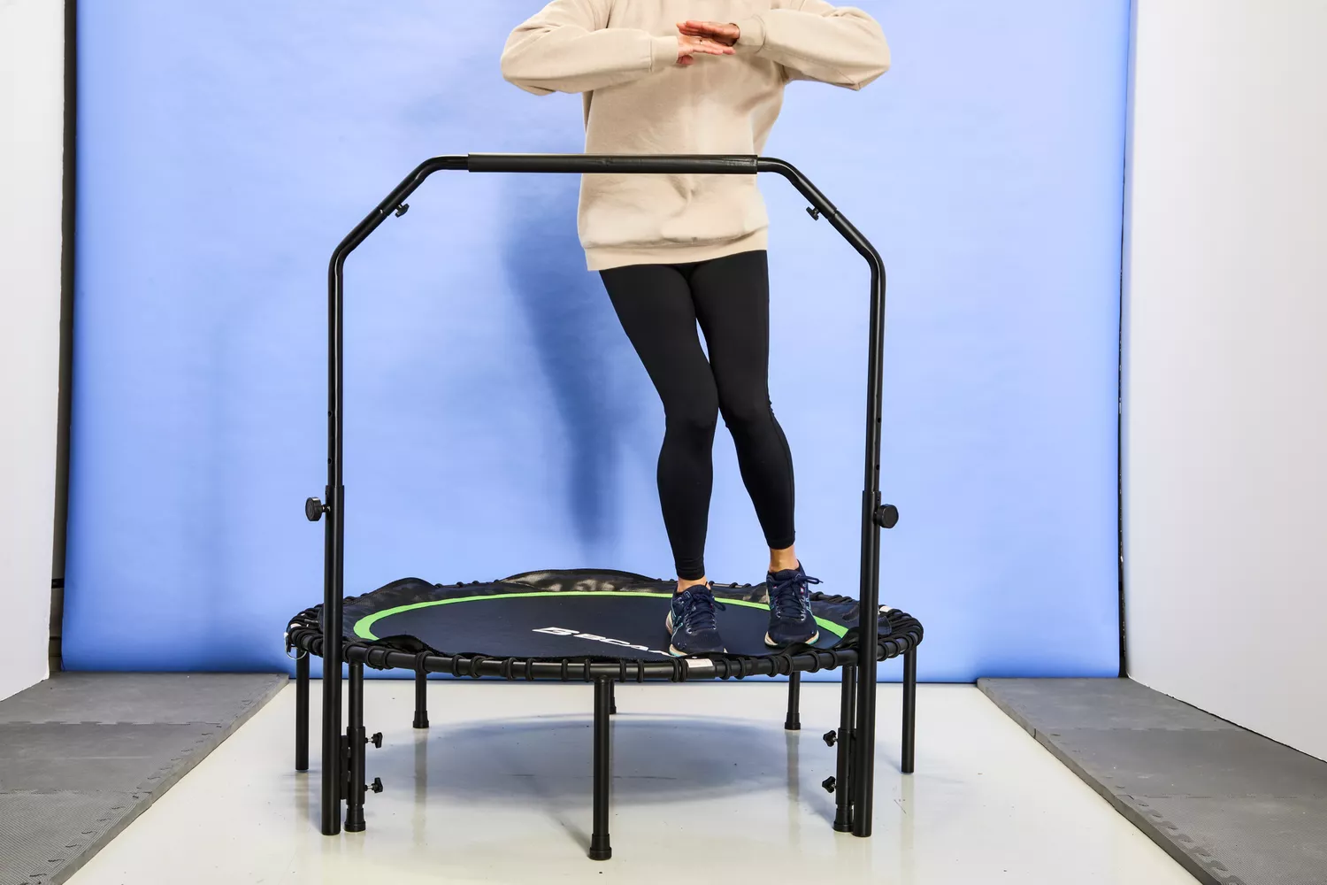 A person jumping on the side of the BCAN 450/550 Lbs Foldable Mini Trampoline