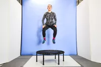 A person in the air above the bellicon 39 Inch Mini Trampoline