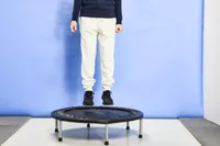 A person in the air over the Fitness Gear Mini Trampoline