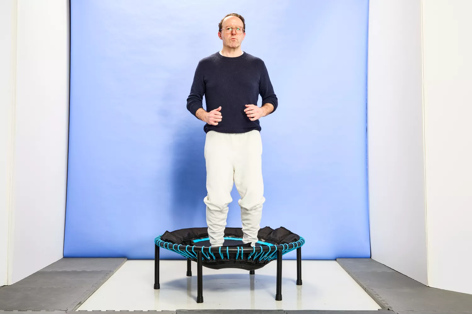 A person jumping on the Leaps and Rebounds Mini Fitness Trampoline and Rebounder
