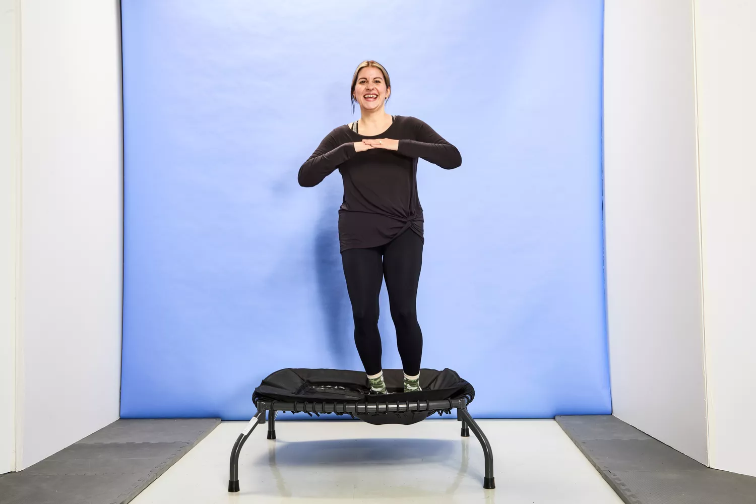 A person jumping to the side of the Sunny Health & Fitness 36 Inch Indoor & Outdoor Exercise Trampoline