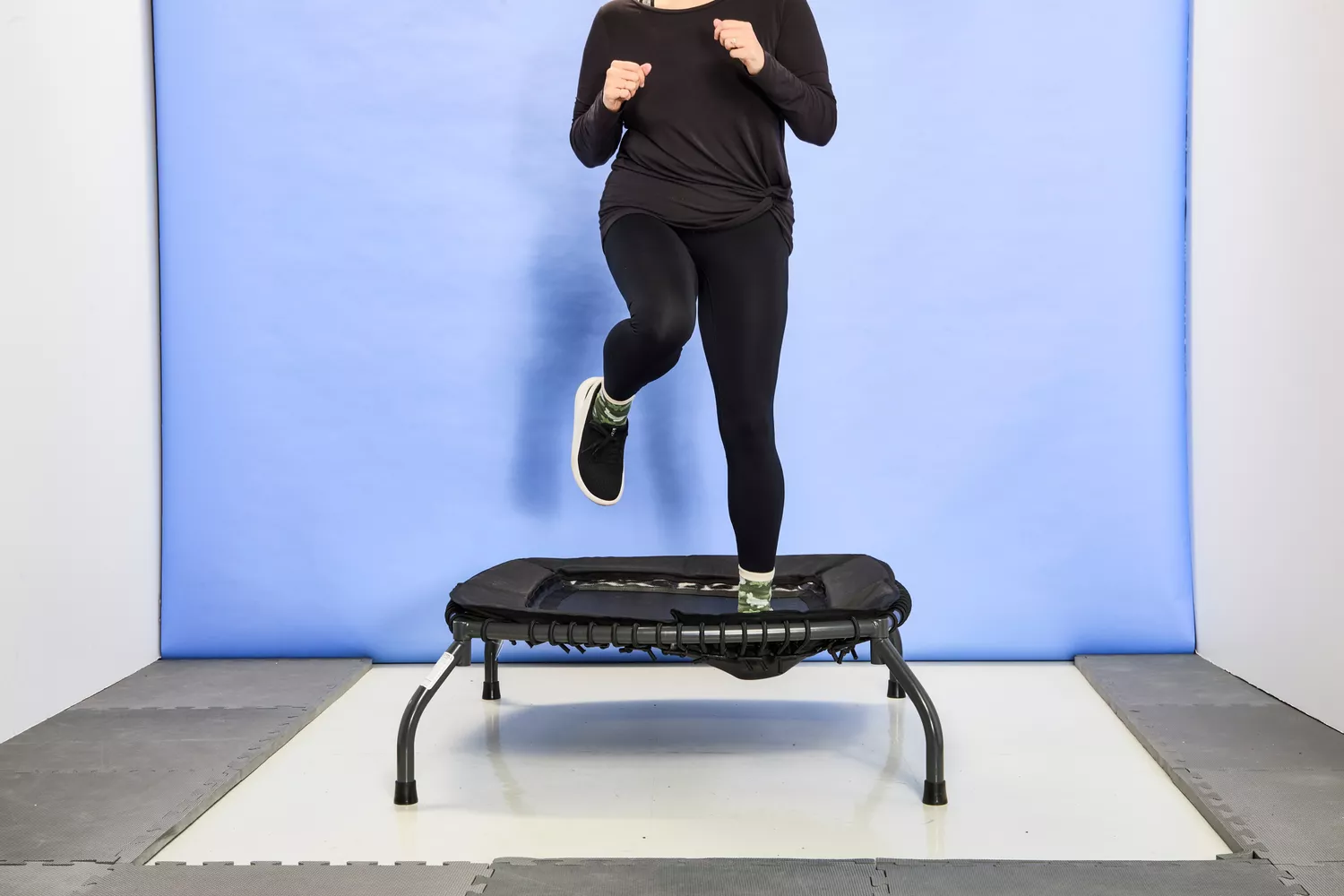 A person moving on the Sunny Health & Fitness 36 Inch Indoor & Outdoor Exercise Trampoline