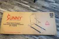The Sunny Health & Fitness Pacer Smart Compact Auto Incline Treadpad Treadmill box