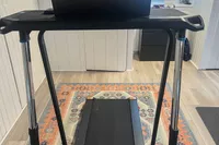 A front view of the Sunny Health & Fitness Pacer Smart Compact Auto Incline Treadpad Treadmill