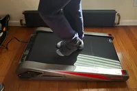 Person using Egofit Walker Pro-M1 Treadmill placed on wood floor