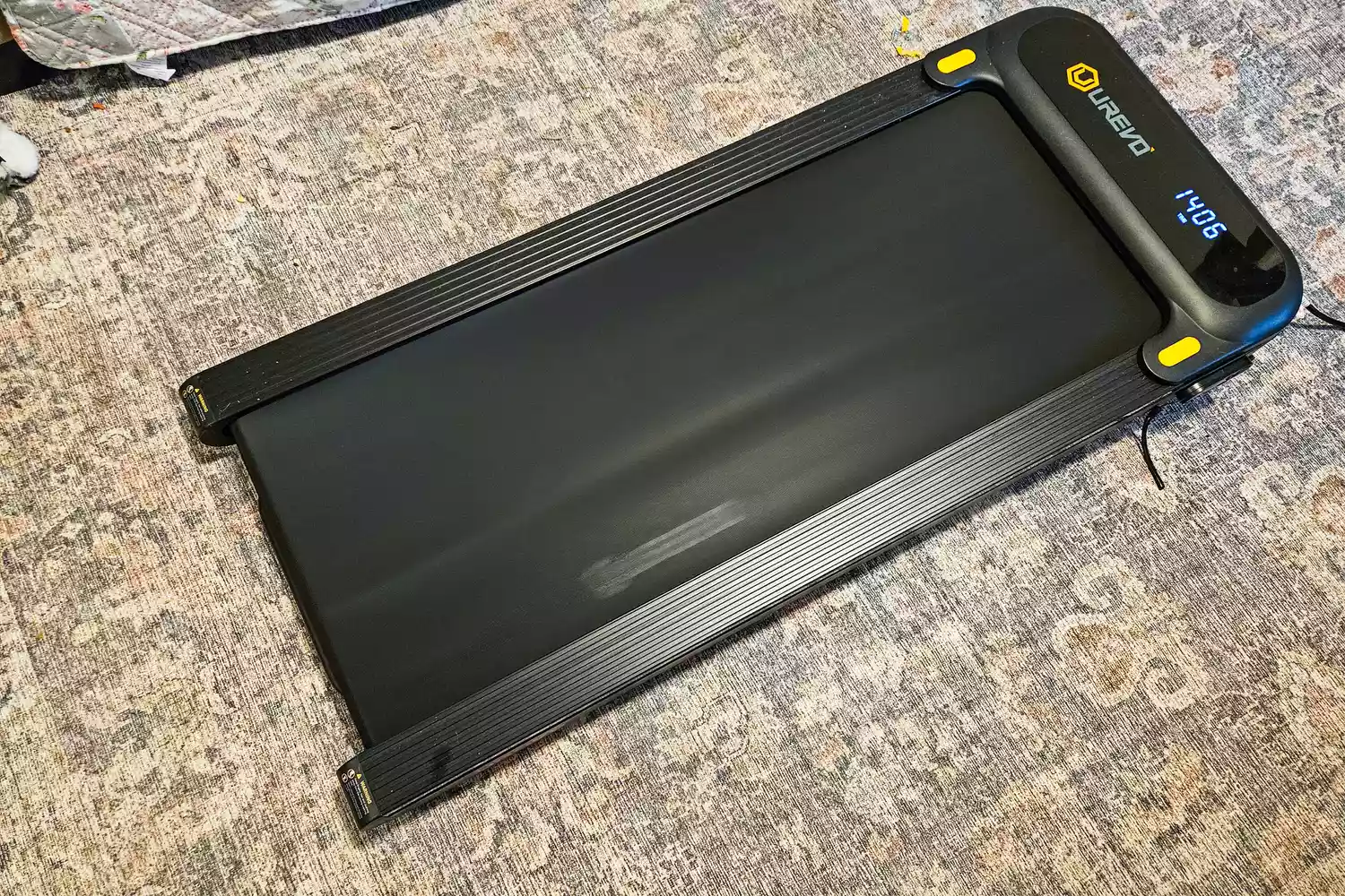 The Urevo SpaceWalk 3S Treadmill on a rug