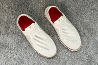 A pair of Vionic Women's Sage RX Recovery Slip-On Shoes on carpet