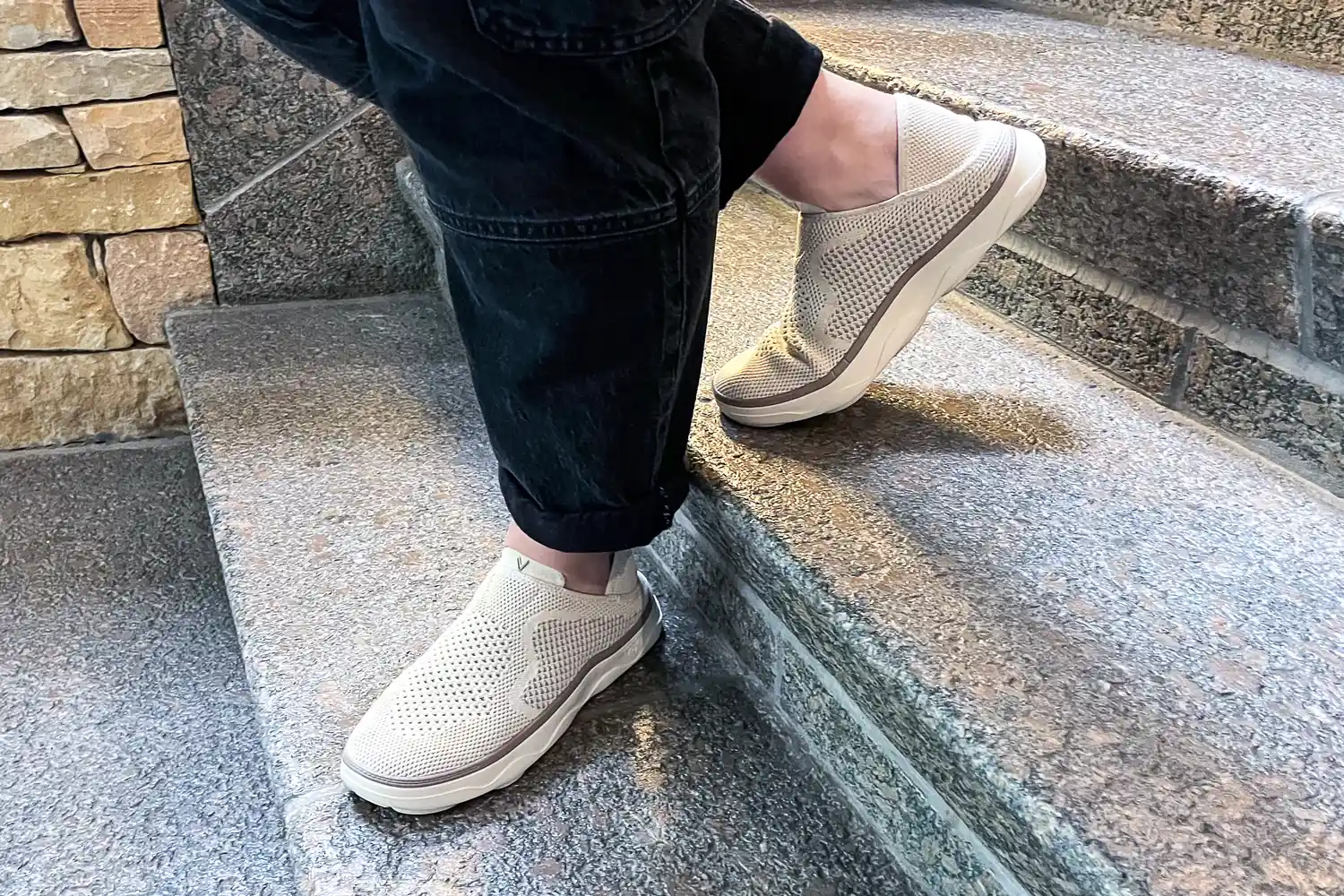 A person walks down stairs while wearing the Vionic Women's Sage RX Recovery Slip-On Shoes