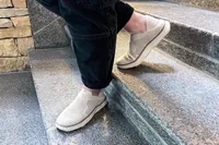 A person walks down stairs while wearing the Vionic Women's Sage RX Recovery Slip-On Shoes