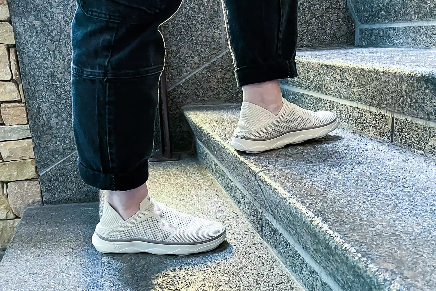 A person walks up the stairs while wearing the Vionic Women's Sage RX Recovery Slip-On Shoes