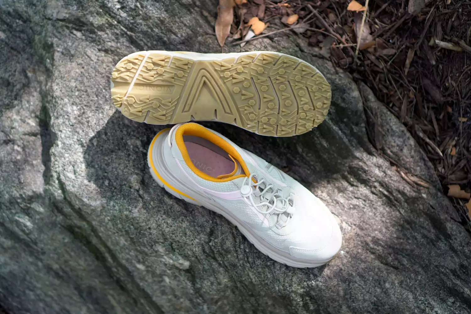 The Vionic Walk Max Sierra Sneakers on a rock