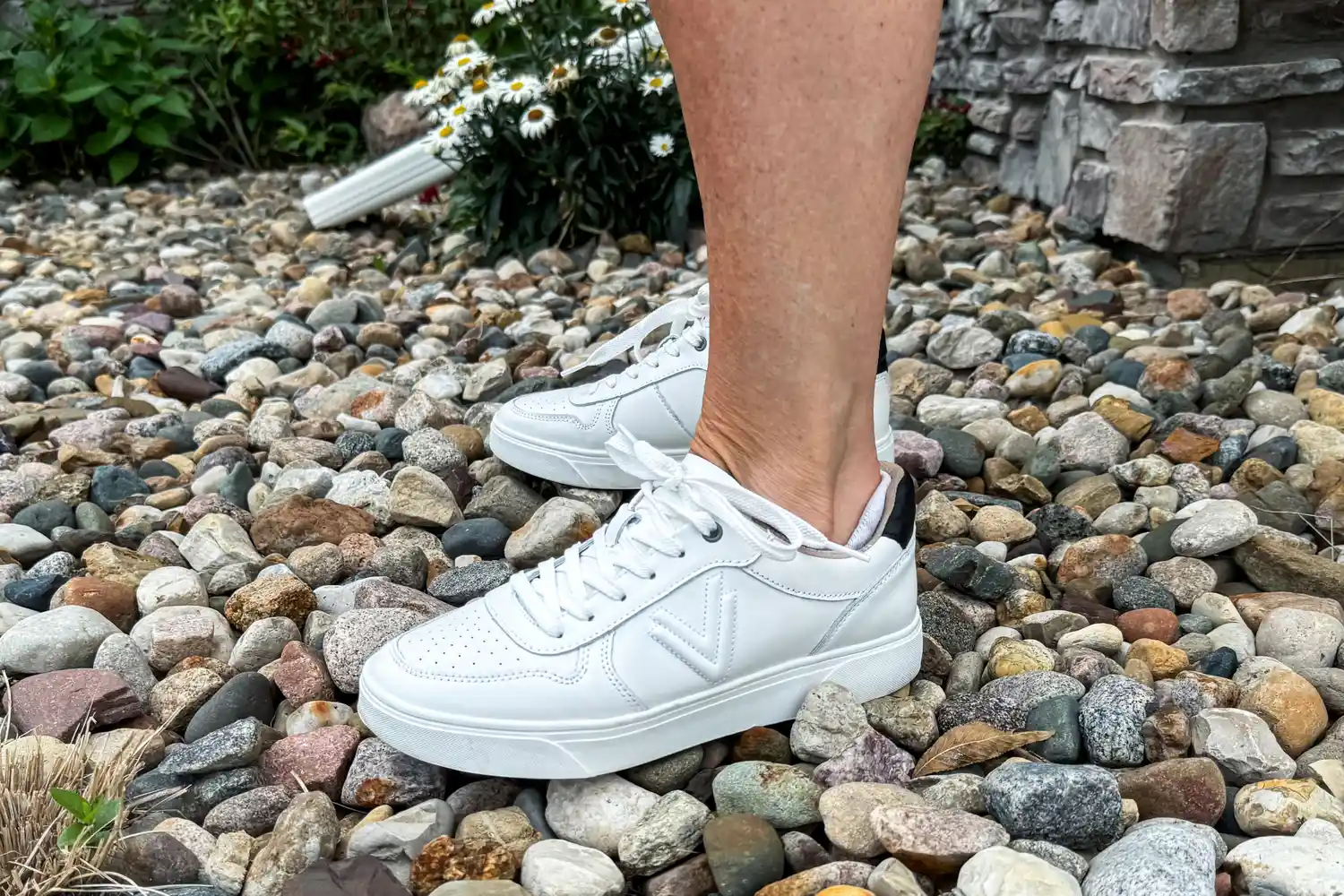 A side view of a person wearing the Vionic Women's Kimmie Court Sneakers