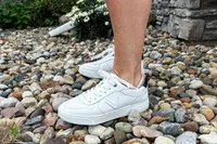 A side view of a person wearing the Vionic Women's Kimmie Court Sneakers