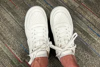 An overhead view of a person wearing the Vionic Women's Kimmie Court Sneakers